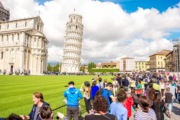Tourists visiting the Leaning Tower of Pisa